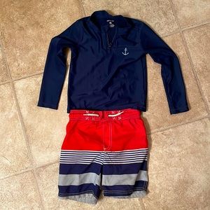 Carter’s swim trunks and long sleeve rash guard